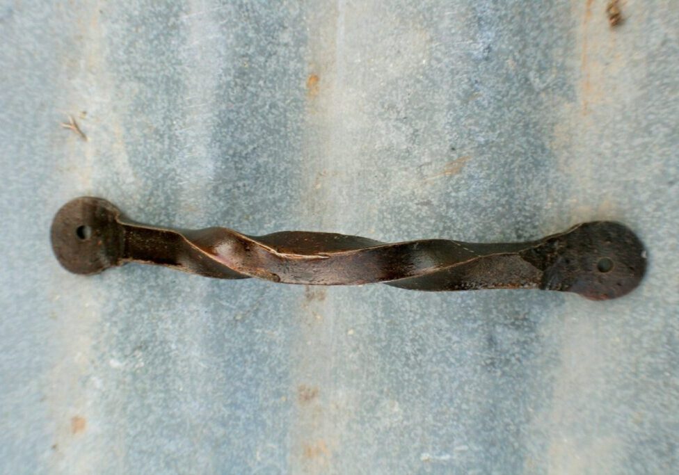 Hand forged steel cabinet handle with reverse twist